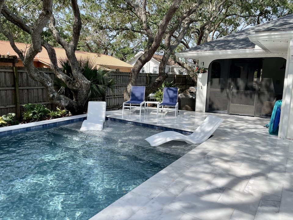 Heated pool and screened in patio.