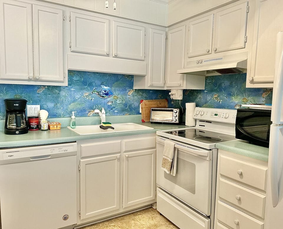Fully stocked kitchen with coffee bar