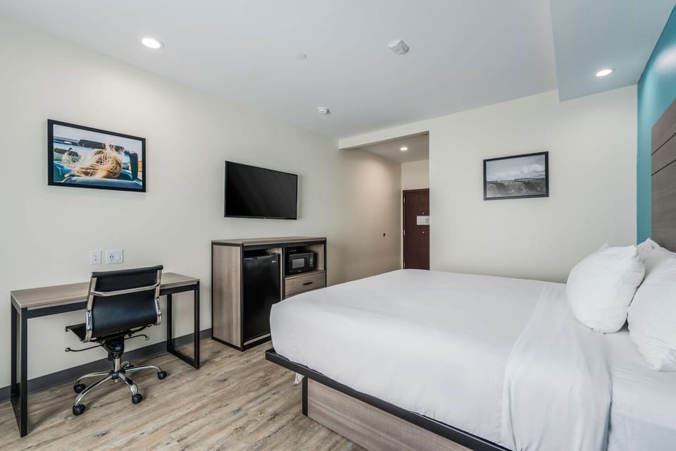 Settle in with a dedicated desk, TV, and snack station.