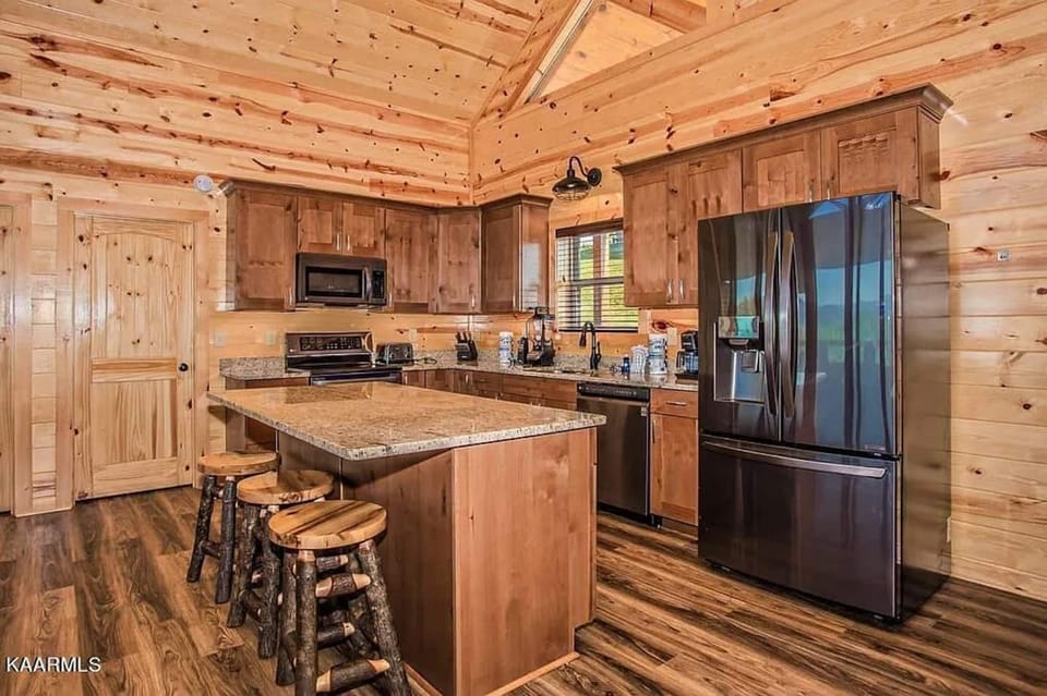Fully equipped kitchen with granite countertops and stainless appliances.