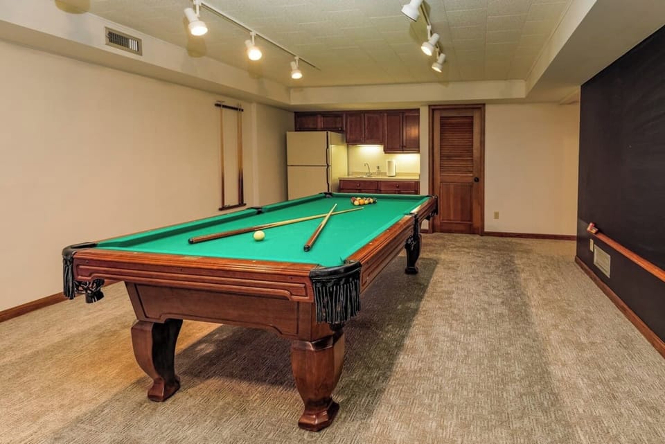 Let your competitive spirit run free with the pool table or ping pong table in the lower level common space.  Keep track of who's winning with the huge chalkboard that's fun for all.  Or make a drink at the wet bar.
