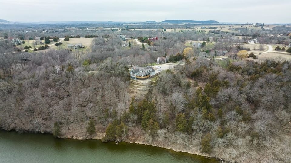 This aerial view of the house gives you a sense for how much space you'll have for fun with family and friends, and shows the house's location relative to the lake.