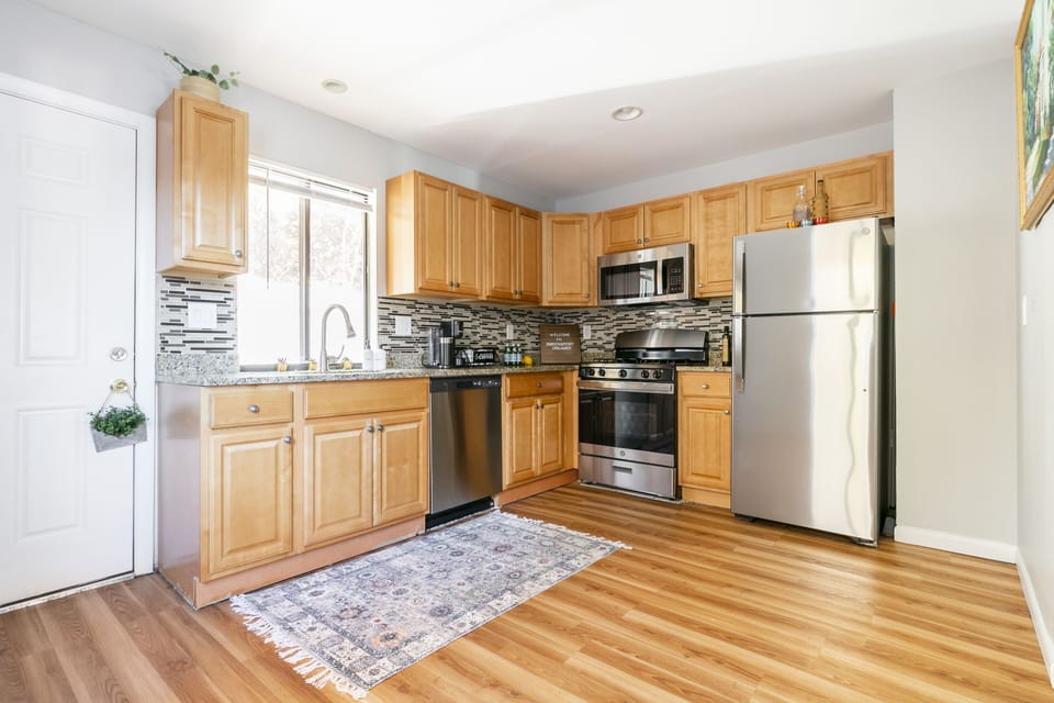 Fully stocked kitchen with stainless steel appliances