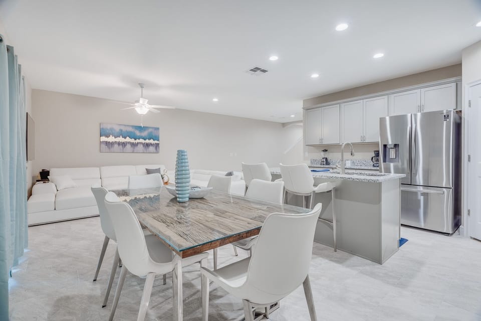 Spacious Dining Area with Adjacent Bar Stools for Additional Seating