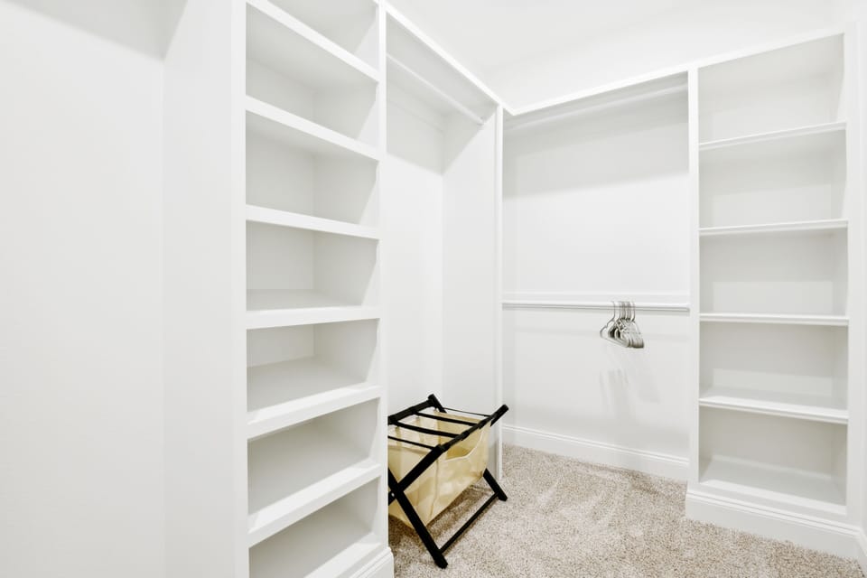 Large walk-in closet in master bedroom