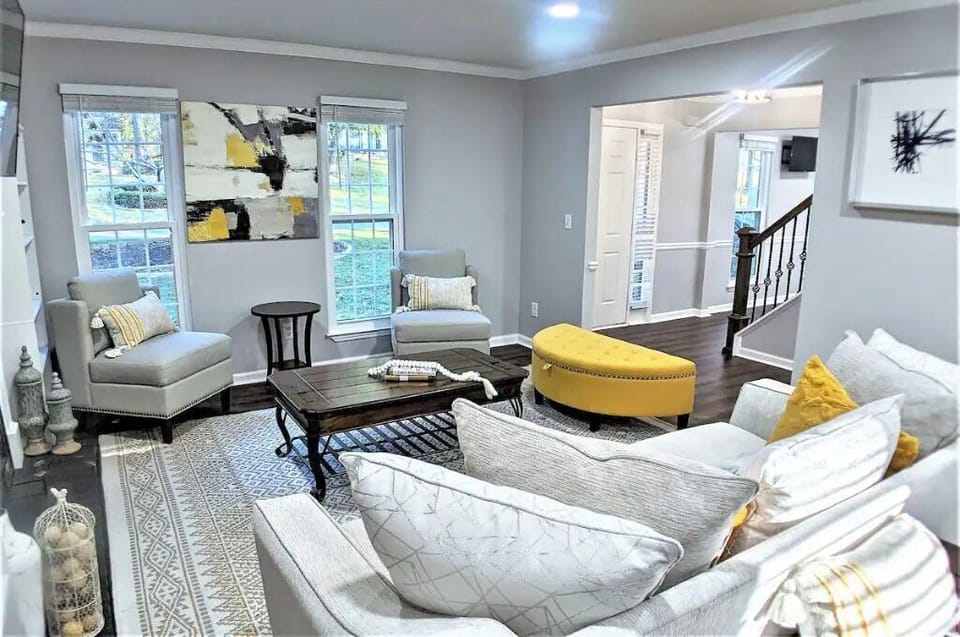 Welcome home to a warm tranquil living room with a 55' TV above the fireplace!