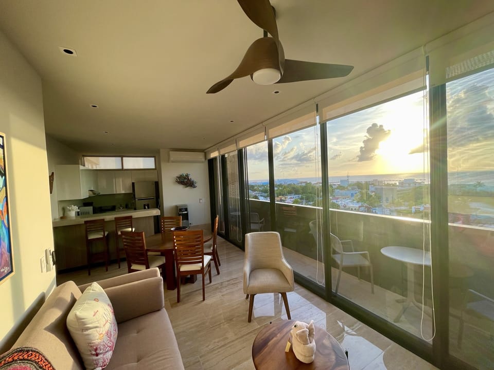 Floor to ceiling windows ... watch the sunset from the terrance. 