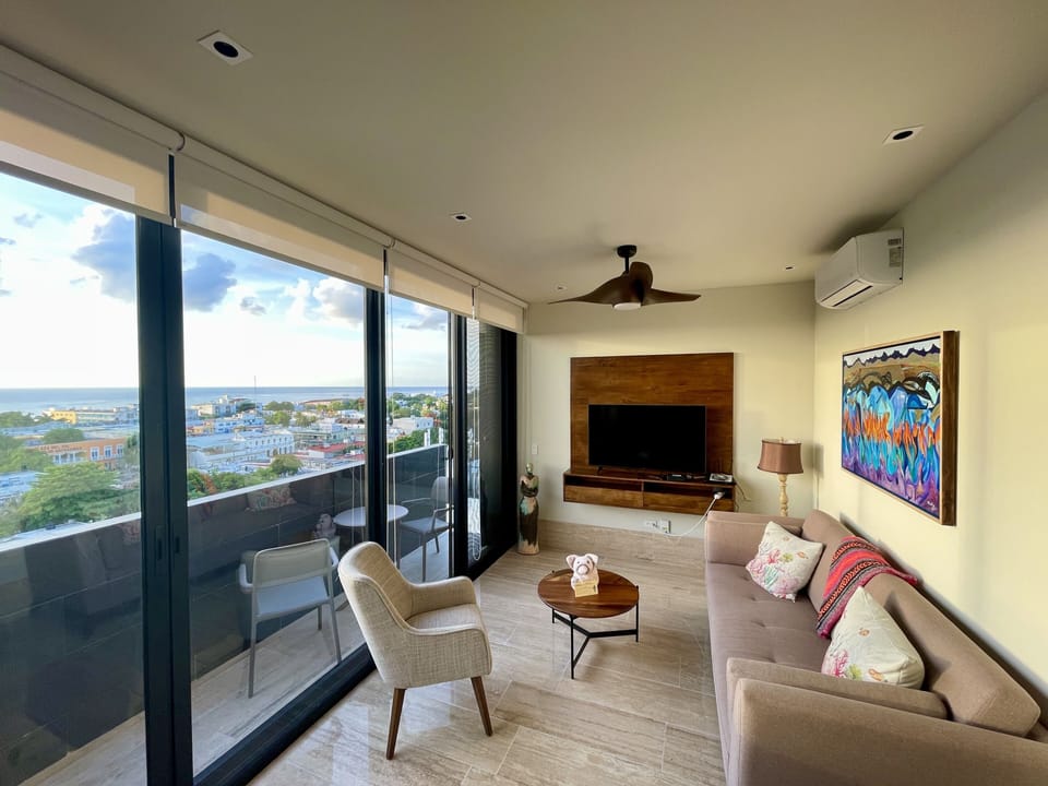 Casa Pakal's comfortable living room with spectacular ocean and city views.
