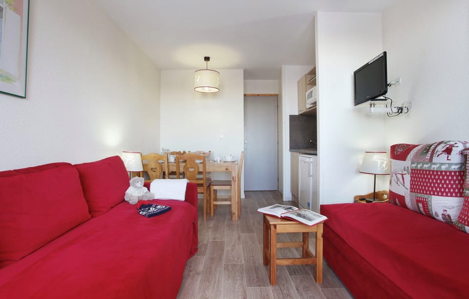 Prepare meals in the kitchenette and enjoy them at the dining table.