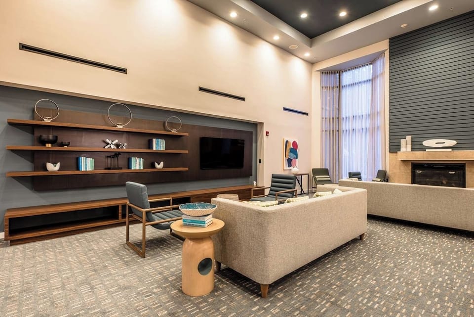 Settle into the stylish lounge and relax by the glowing fireplace.