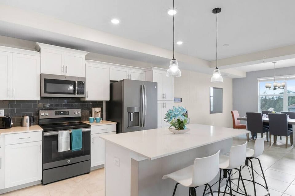 Kitchen & Island with pendant lights!#Disney #Parks #kingdom #springs #StoreyLake #Apartment #Vacation #Rental #waterpark #Kissimmee #Orlando #universal #citywalk