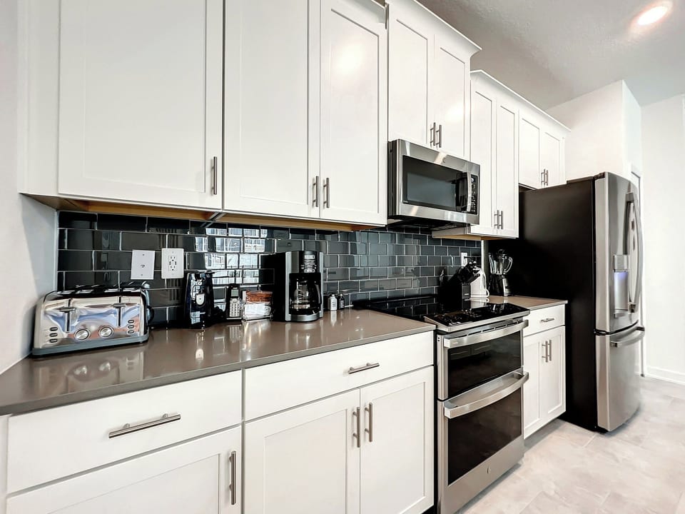 Modern Kitchen with White Cabinets and Stainless Appliances