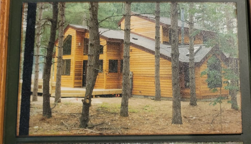 Summer - Side view showing main entrance.