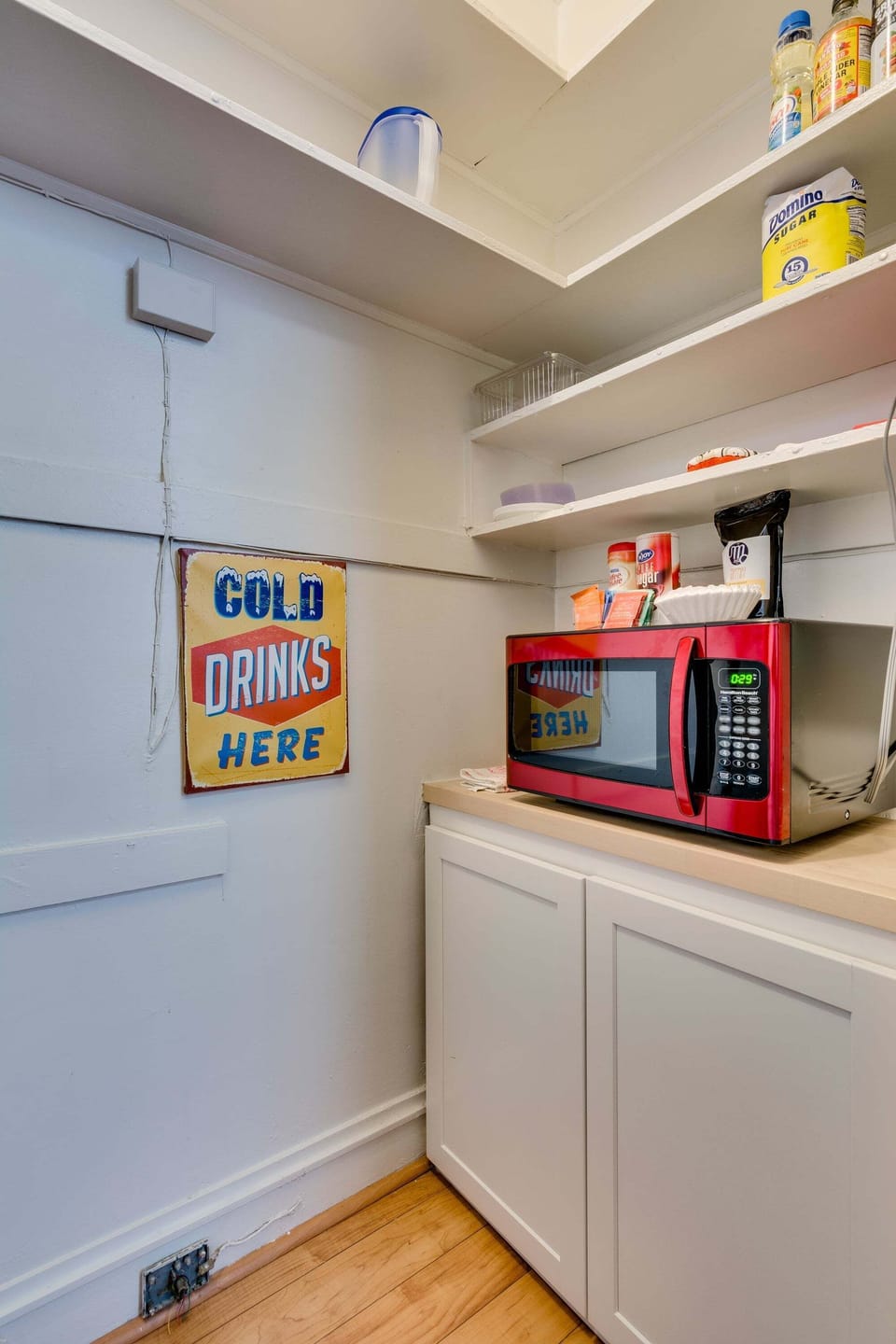The fridge and microwave are tucked into a pantry in the kitchen!