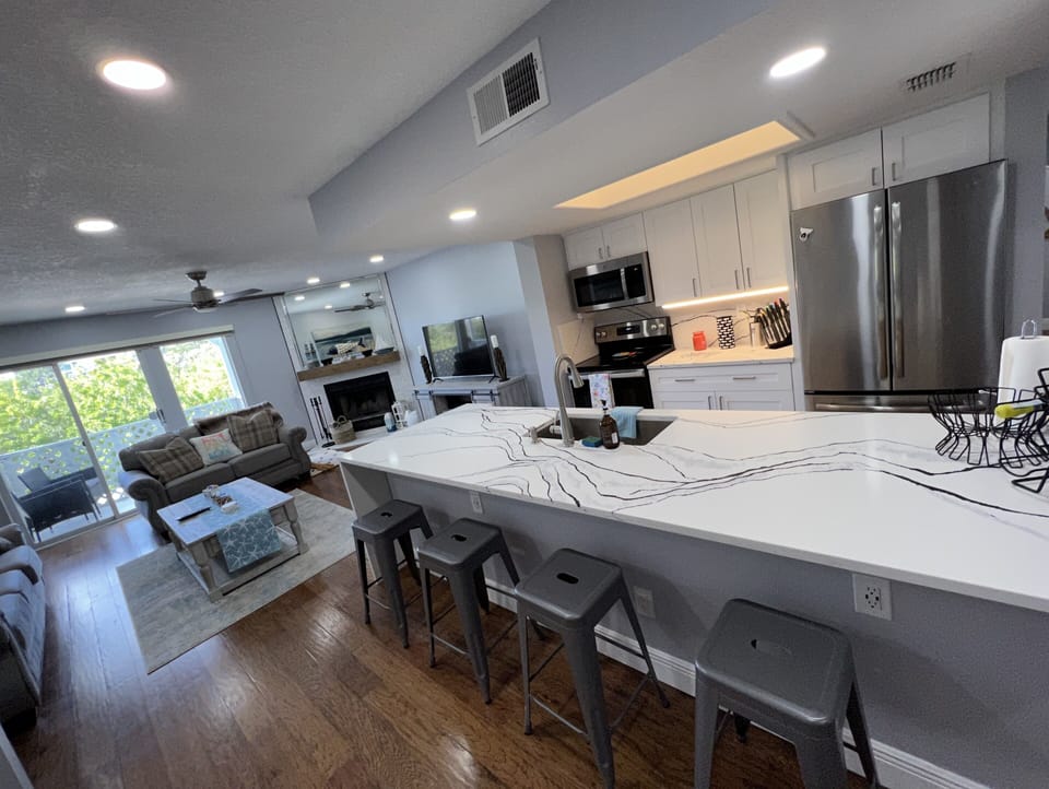 Completely remodeled with breathtaking waterfall ten foot island in quartz!