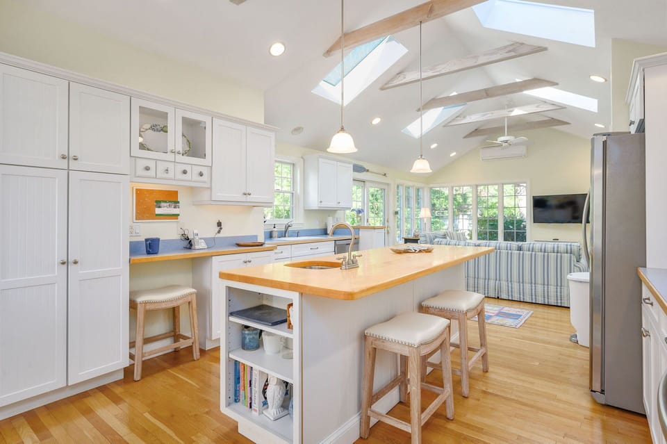 Center island with two stools at 6 Brooks Lane Harwich Port Cape Cod - New England Vacation Rentals  #BookNEVRDirectBrooksLaneBeachHouse