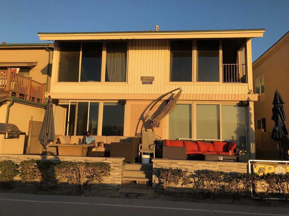 Building is Ocean Front. Condo is ground floor on right. Use of orange furniture