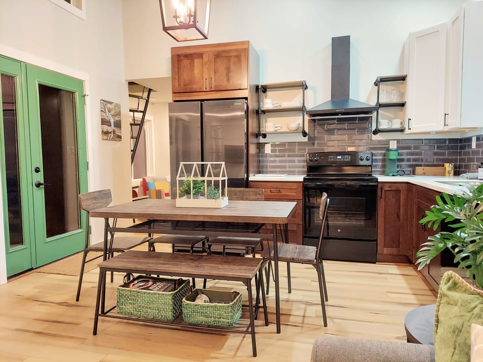 Open kitchen and dining floor plan with seating for 6