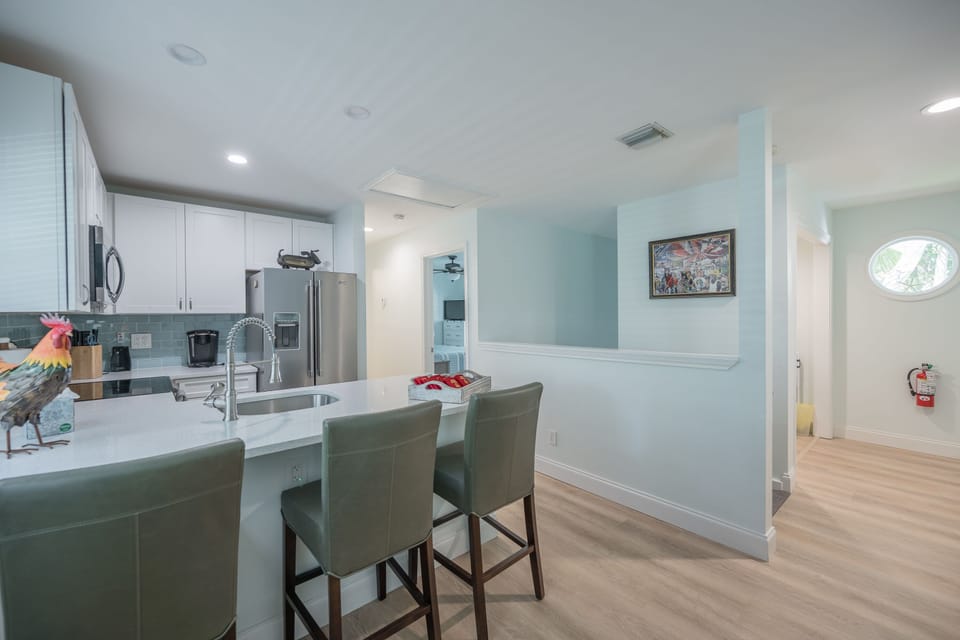 Kitchen with bar stools.