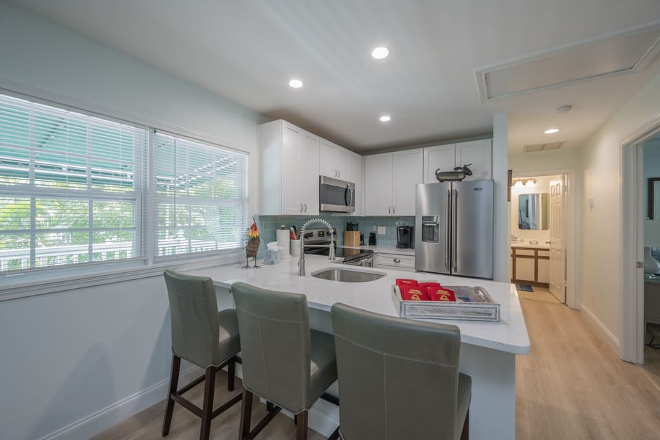 Kitchen with bar stools.