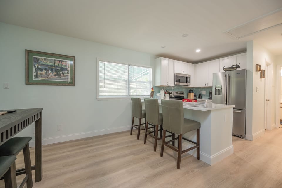 Kitchen with bar stools.