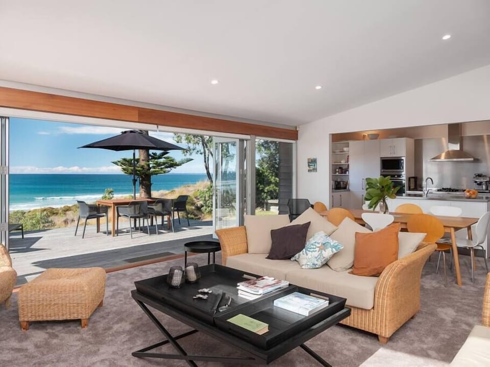 Spacious open plan living flows easily outside with beautiful ocean views