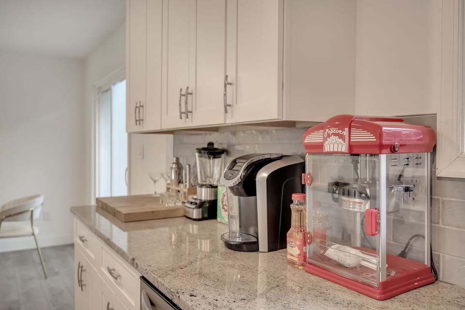 Popcorn machine, Keurig, blender and martini shaker.