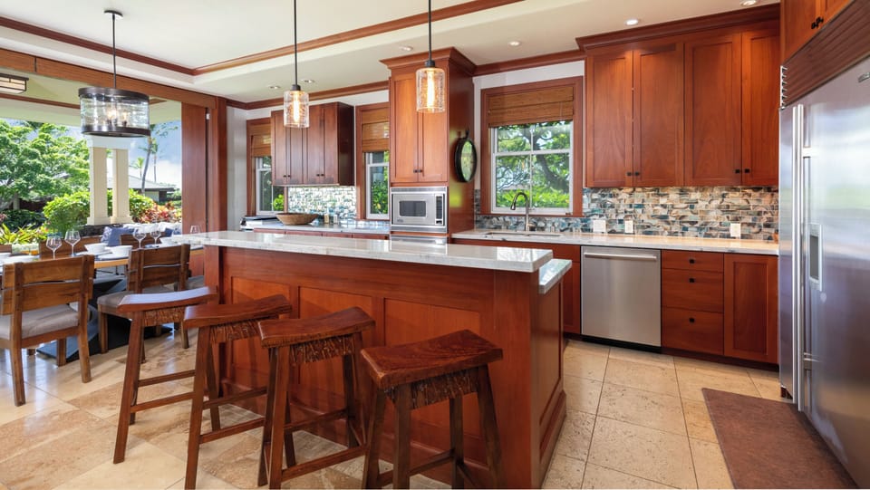 Gourmet kitchen stocked with spices, oils and cookware essentials