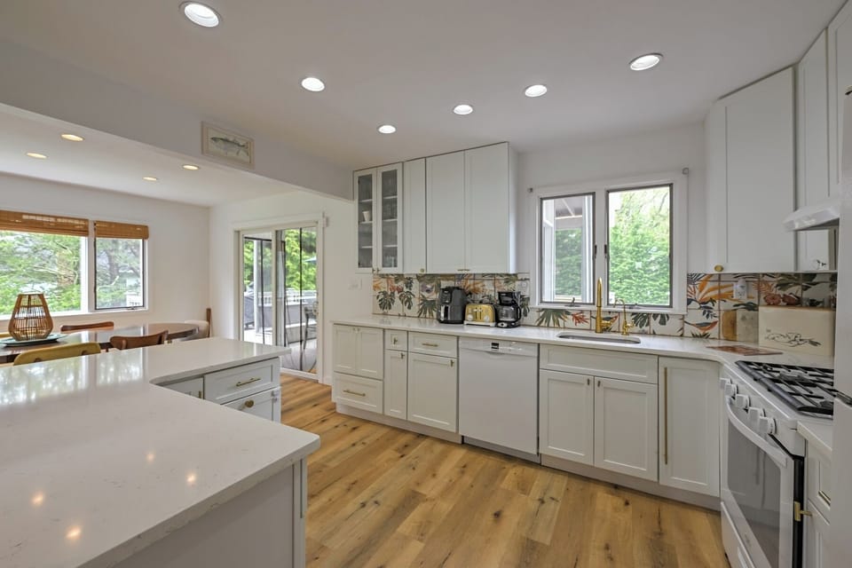 Kitchen complete with air fryer, multiple coffee makers, toaster and microwave. 