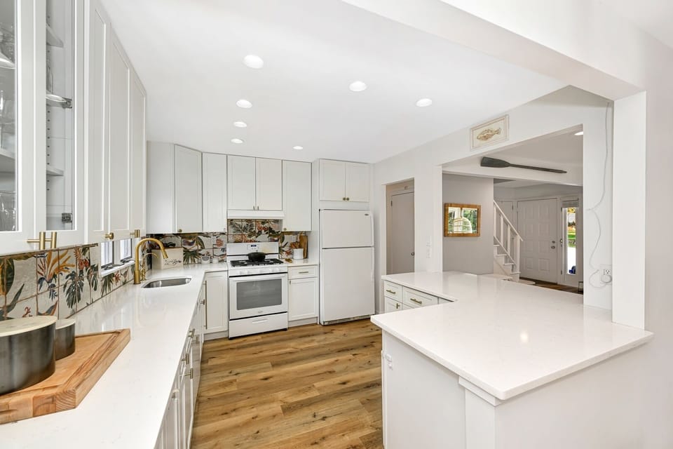 All white chef's kitchen with everything you need. 