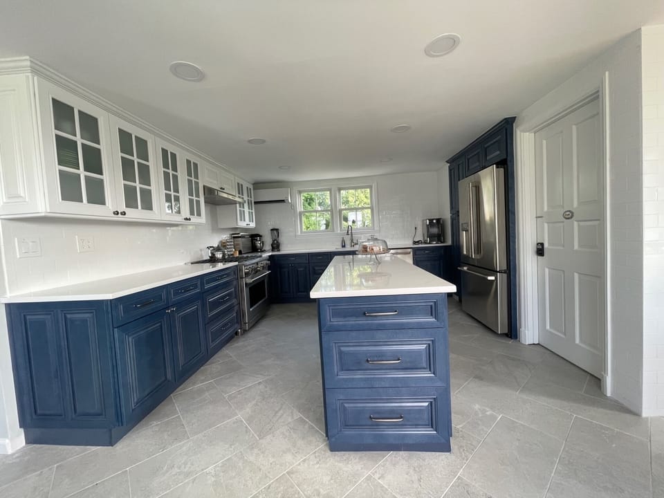 Renovated kitchen includes two sinks and two dishwashers for maximum efficiency 