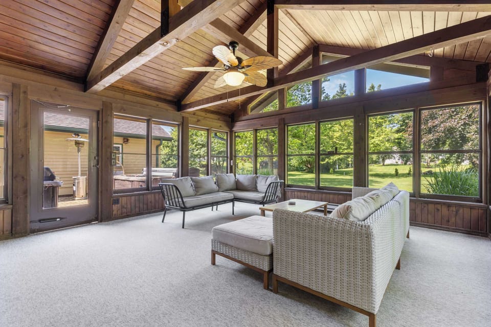 Our beautiful indoor patio with recliner sofas and beautiful bay windows. Perfect for reading a book while you relax