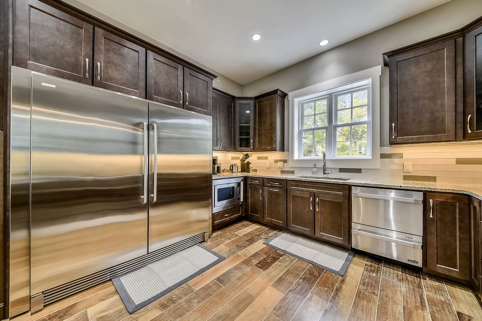 Chef’s kitchen with Keurig, Nespresso, and drip coffee makers, dual dishwashers