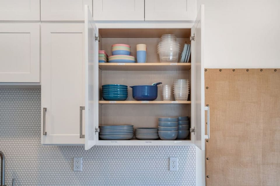The kitchen is fully stocked and has everything from glass bakeware to a full set of dishes to a blender.