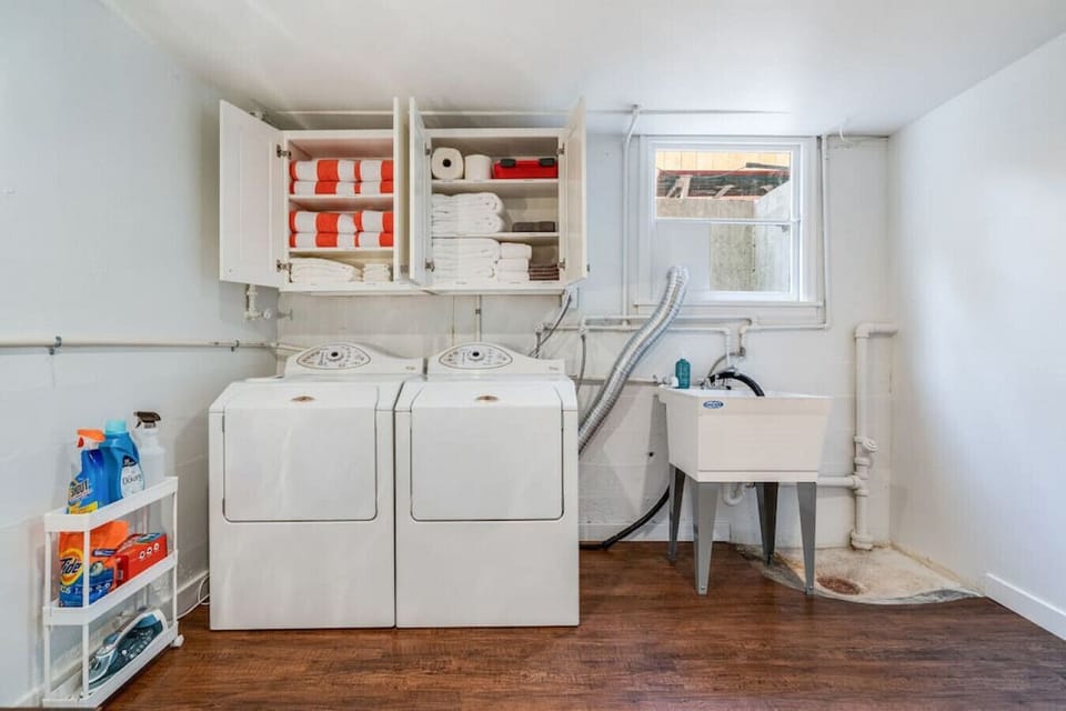 Laundry area fully stocked with all the amenities for a comfortable stay: extra sheets, hot tub towels, toilet paper, paper towels, first aid kit, bath towels, etc.!