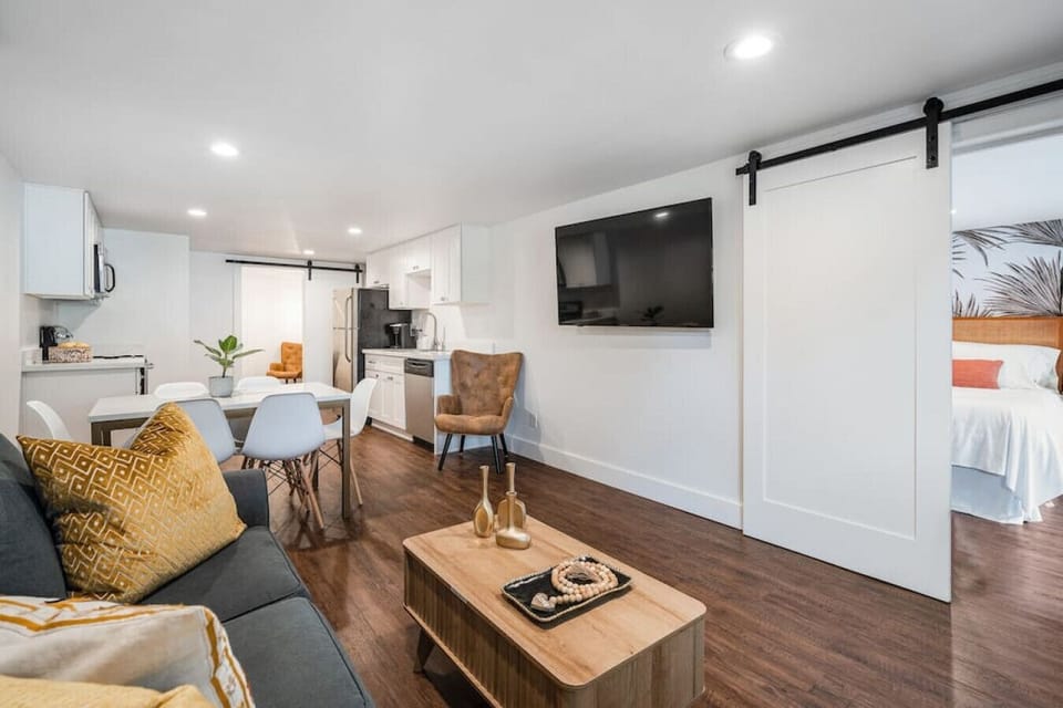 Spacious living room with a cozy sofa.