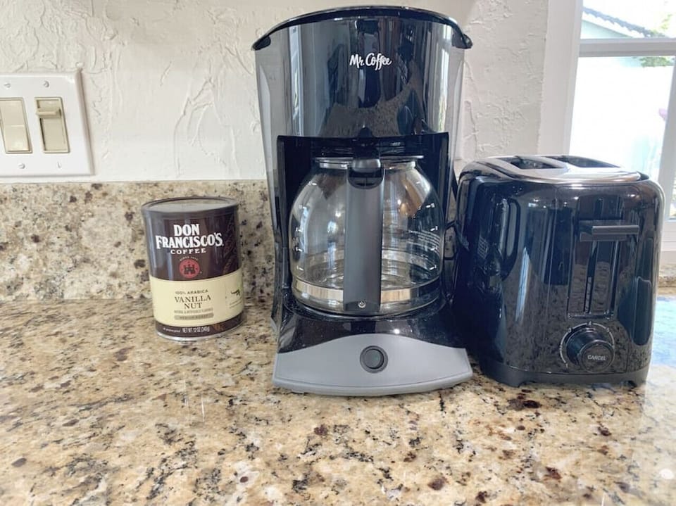 A coffee maker and a toaster.