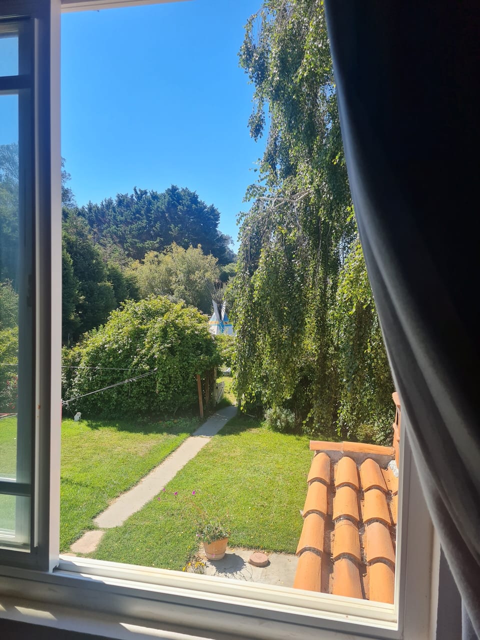 View from garden view bedroom with double bed