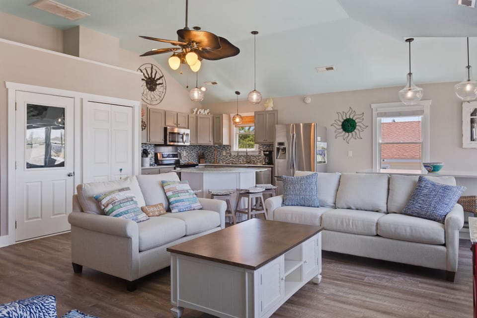Unwind in the Living Area with plenty of cozy furniture and high ceilings.