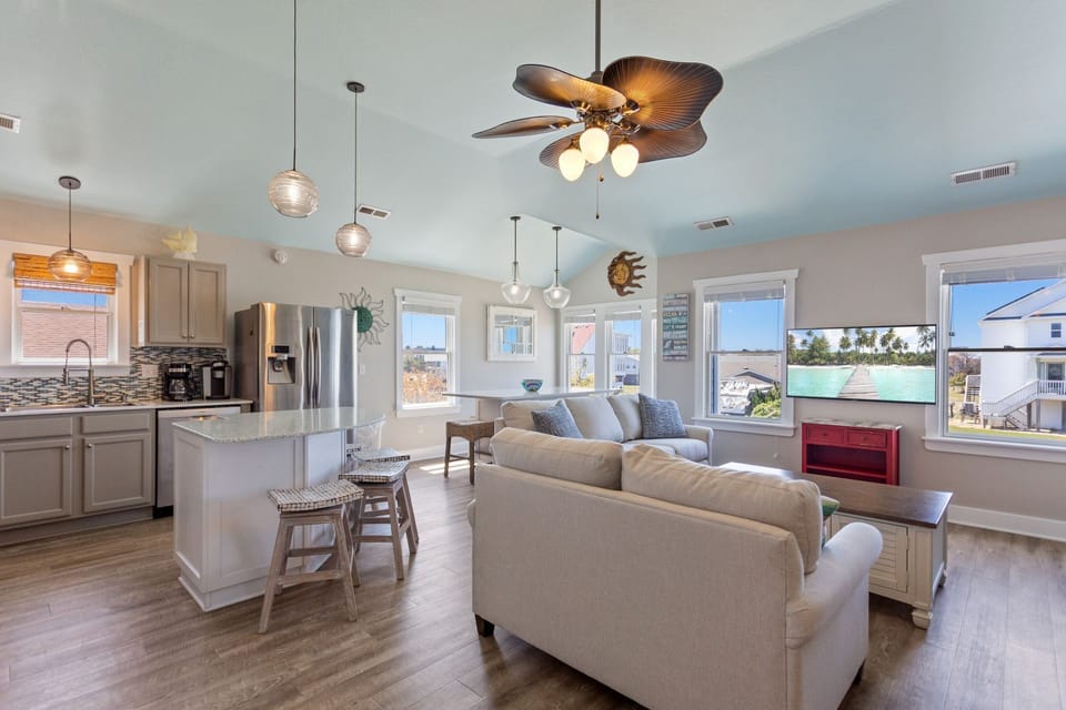 The spacious Mid-Level Living Area is ideal for watching your favorite shows and plan another day of exciting Outer Banks adventures.