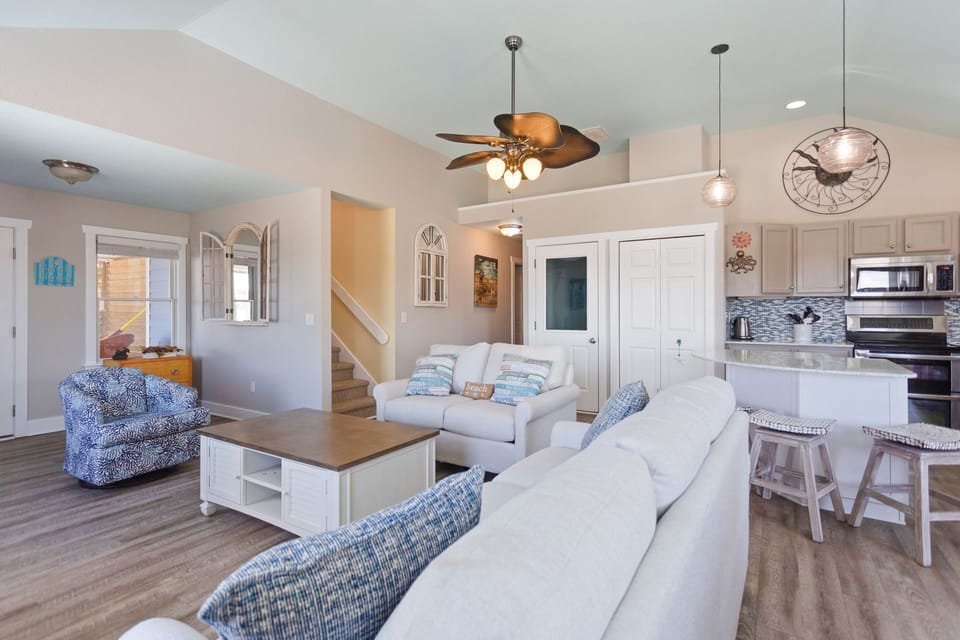 Relax on the cozy furniture in the spacious, well-lit Living Area.