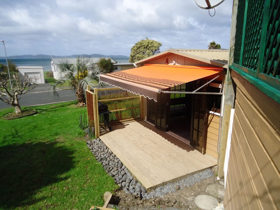 Beautiful garden unit with a north facing deck is situated in a garden setting