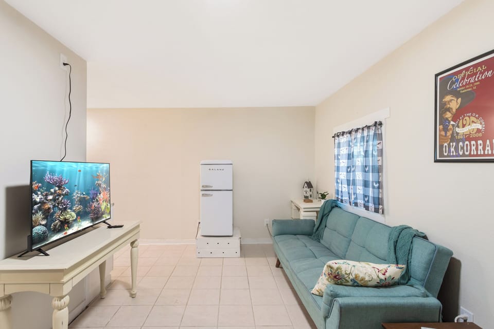 living room with roku tv and futon