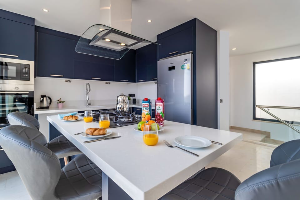 Open plan fully fitted kitchen with an island unit