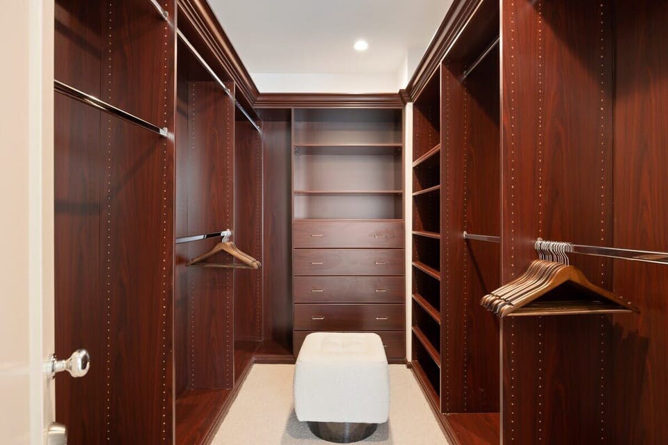 Spacious wooden walk in closet