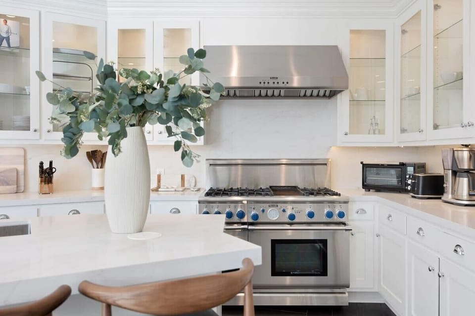 Top-of-the-line stainless steel appliances makes cooking a dream in the open kitchen