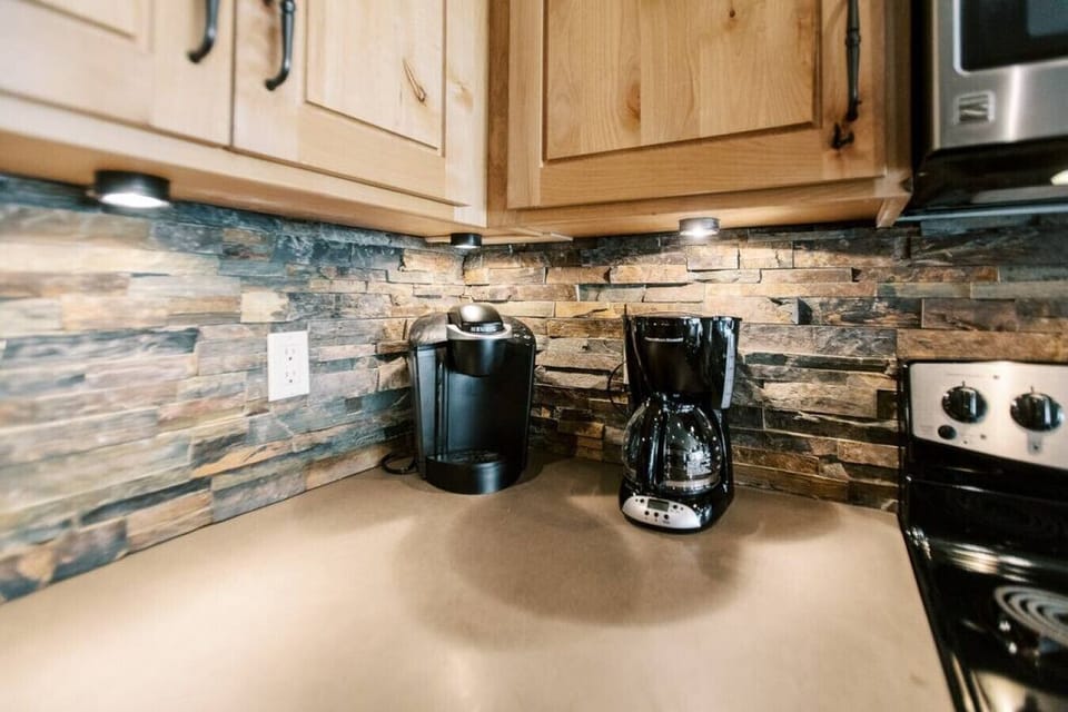 Fully stocked kitchen with lots of appliance to use.
