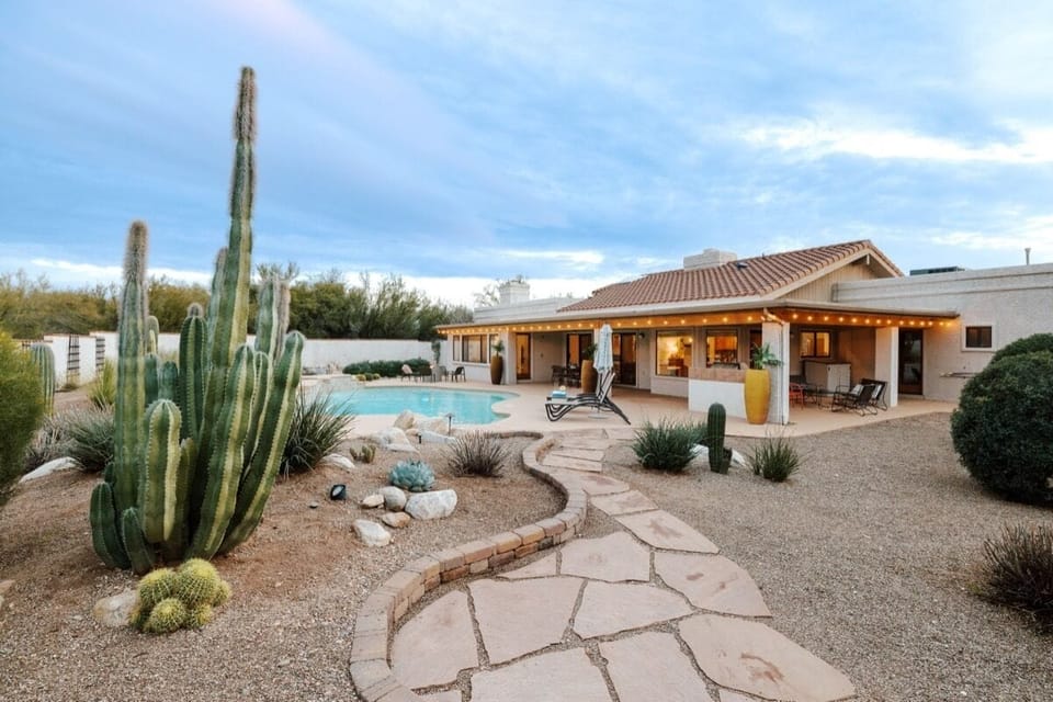 Classic Tucson house with a huge porch and gorgeous desert landscaping.