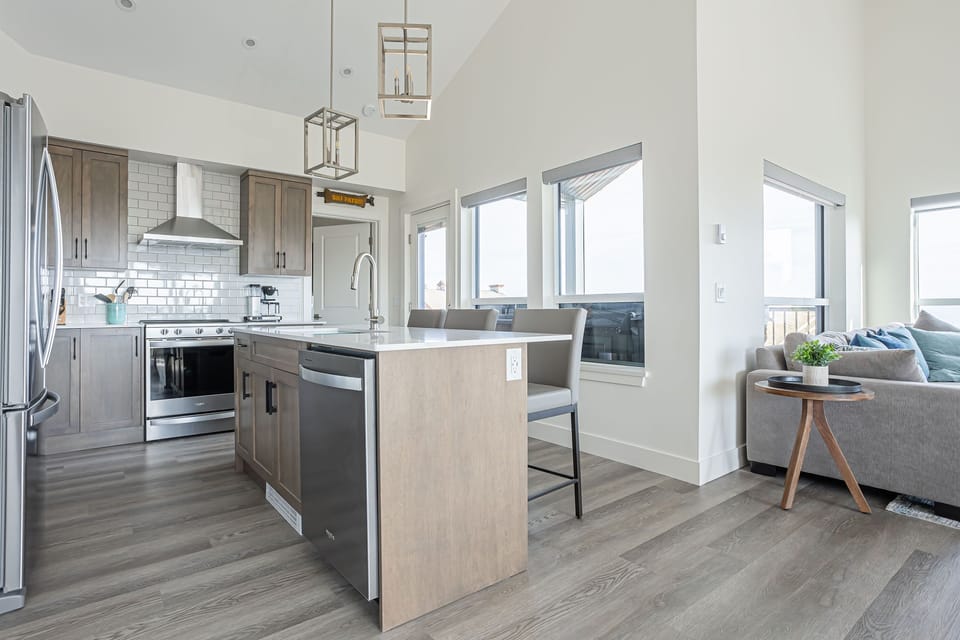 Brand new kitchen with Quartz counters, stainless appliances and lots of light