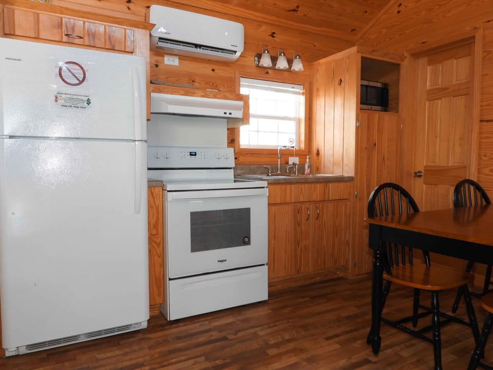 Kitchen area in Deluxe Kozy Kabins.